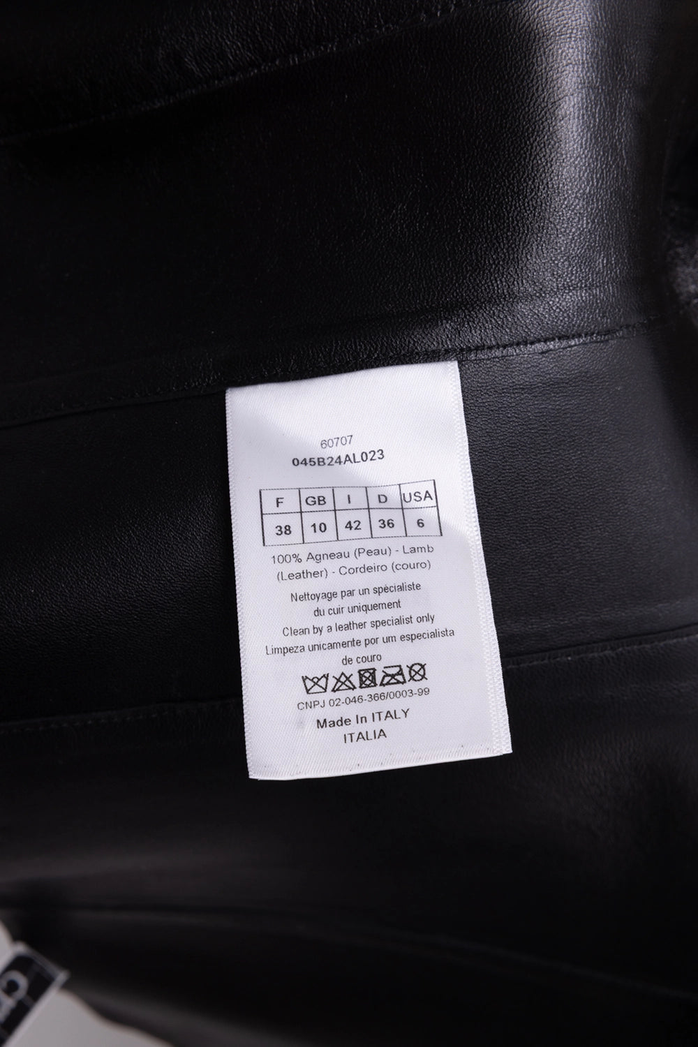 Pre-owned Christian Dior corset top in black, care tag view, lamb leather composition label and size 38