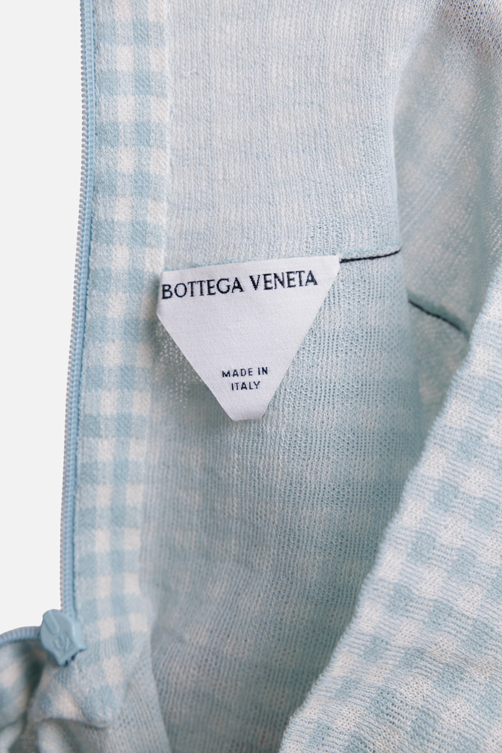 Bottega Veneta women's gingham top in celeste chalk, label view, blue zipper tape and triangle brand tag