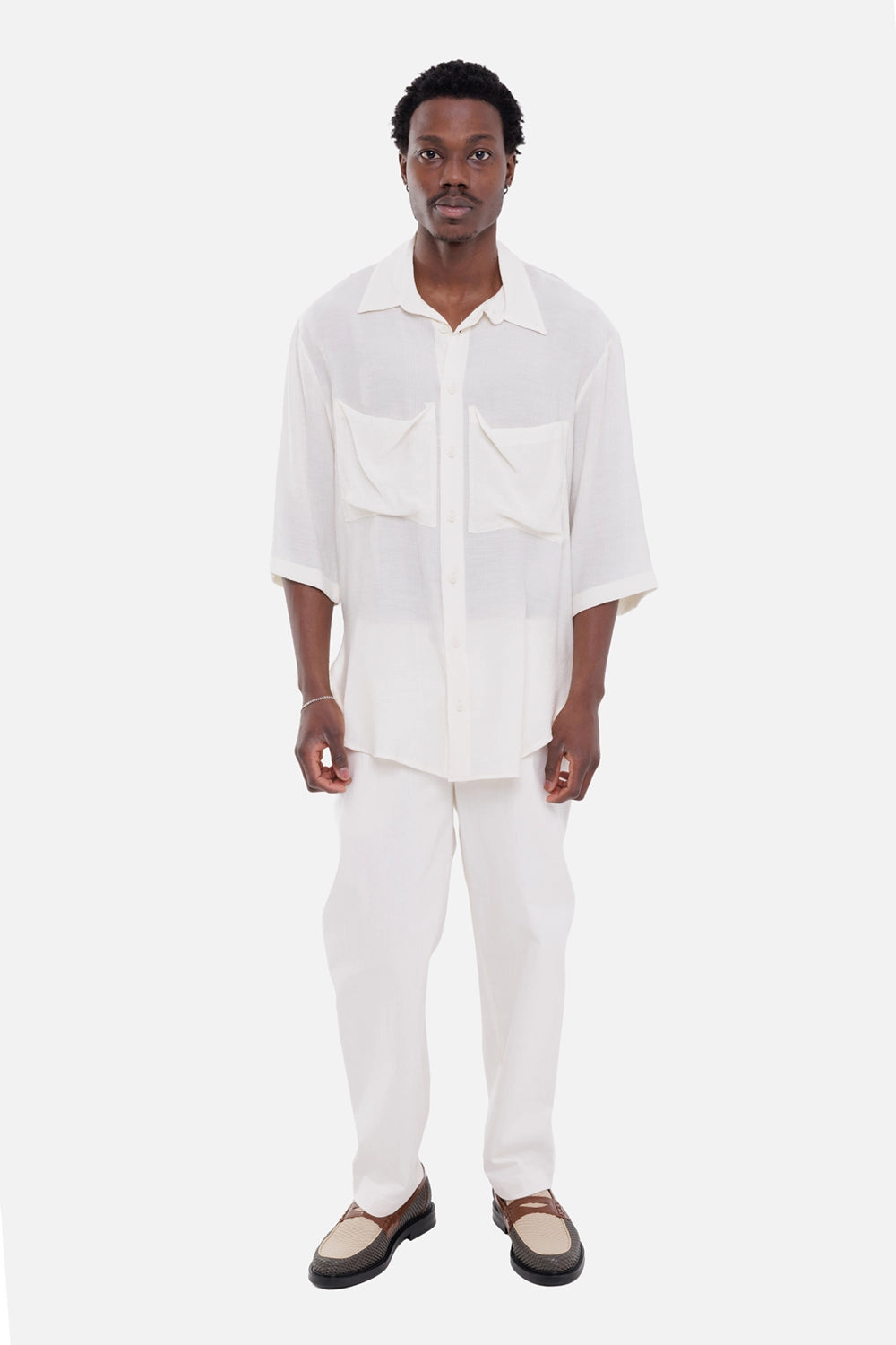 Aion men's trousers in ecru, on-model full-length, straight leg with buttoned waist
