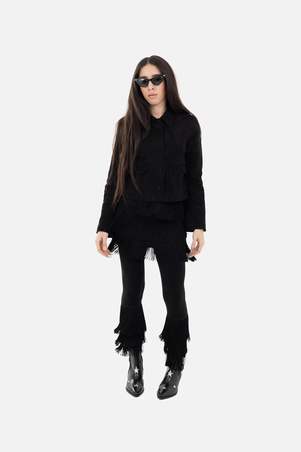Norma Kamali women's cropped leggings in black, on-model full-length, tiered fringe cuffs at calves