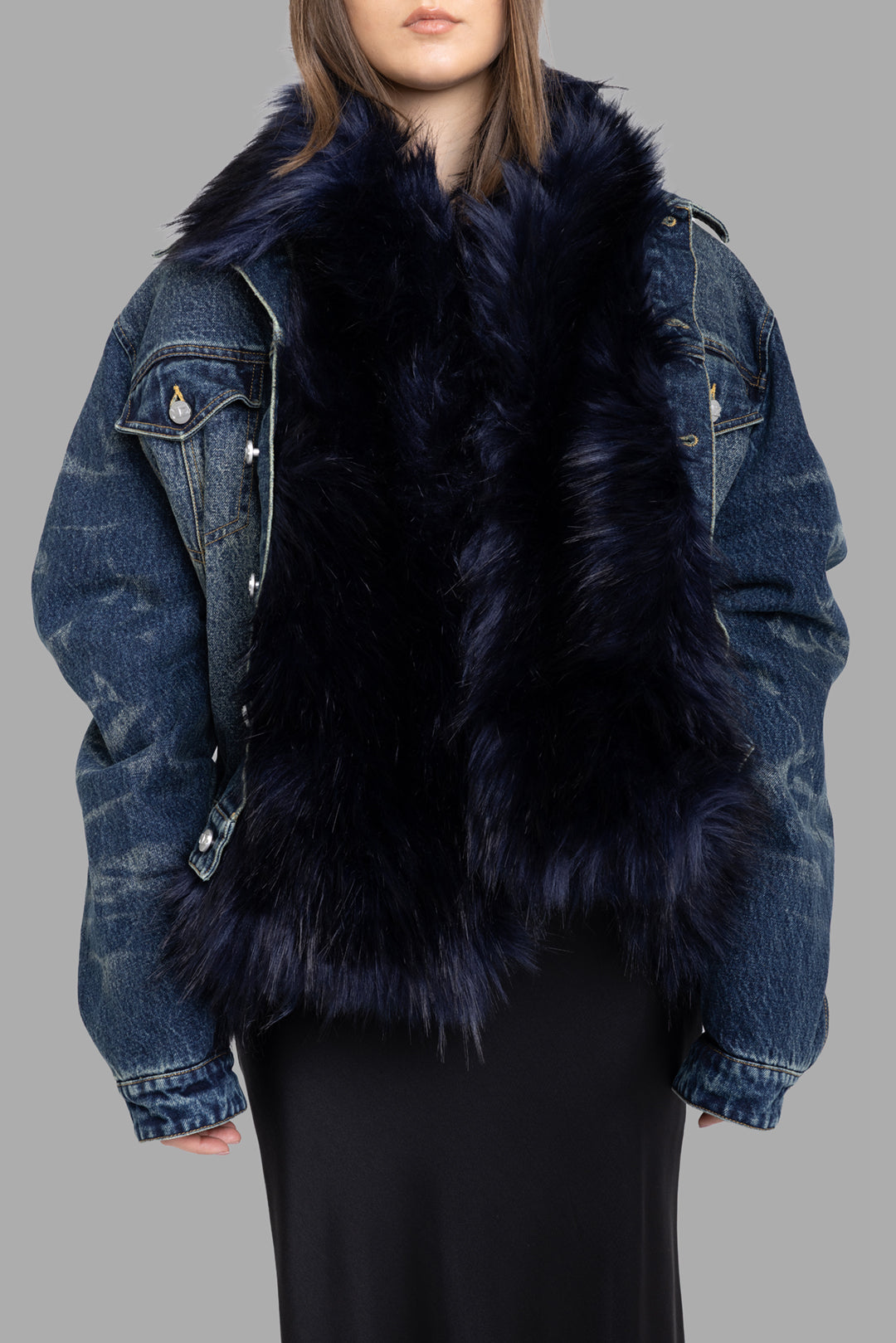 Natasha Zinko women's light wash denim jacket with black faux fur, front half-length view, fluffy faux fur collar and body