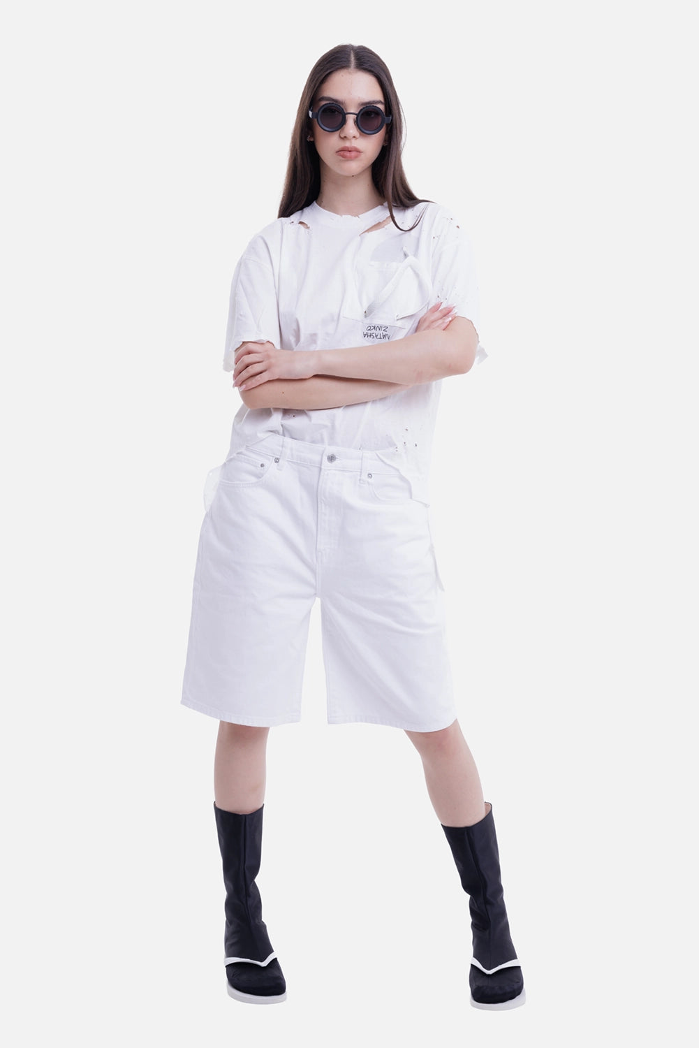 Anine Bing women's white denim shorts, on-model full-length view with relaxed knee-length fit