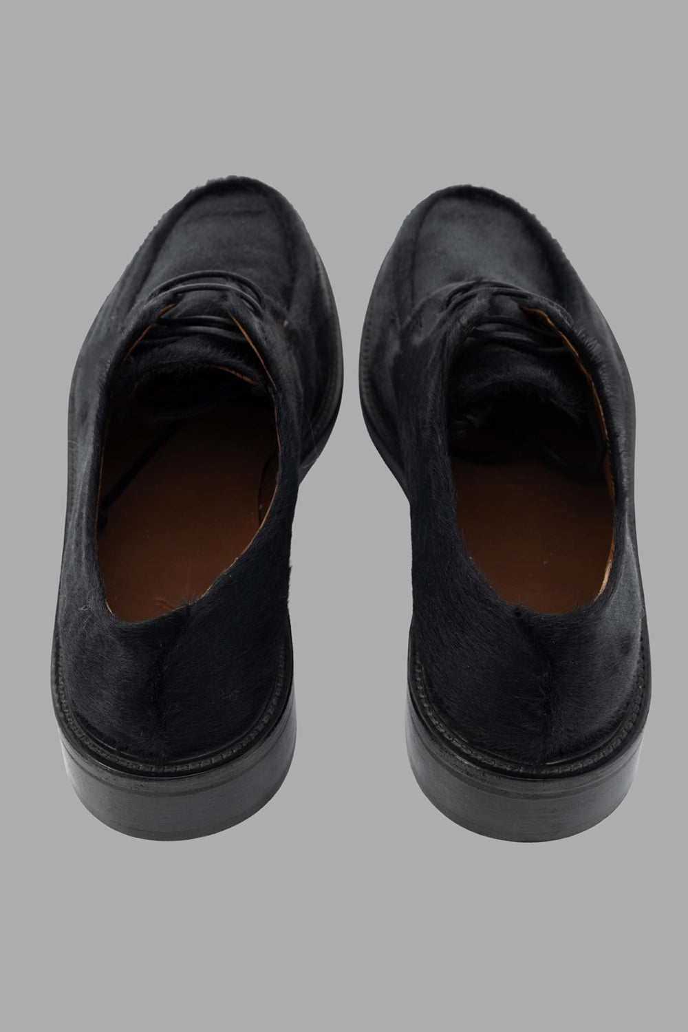 Marsèll men’s derby shoes in black, back view, stacked heel and raw-edge seam