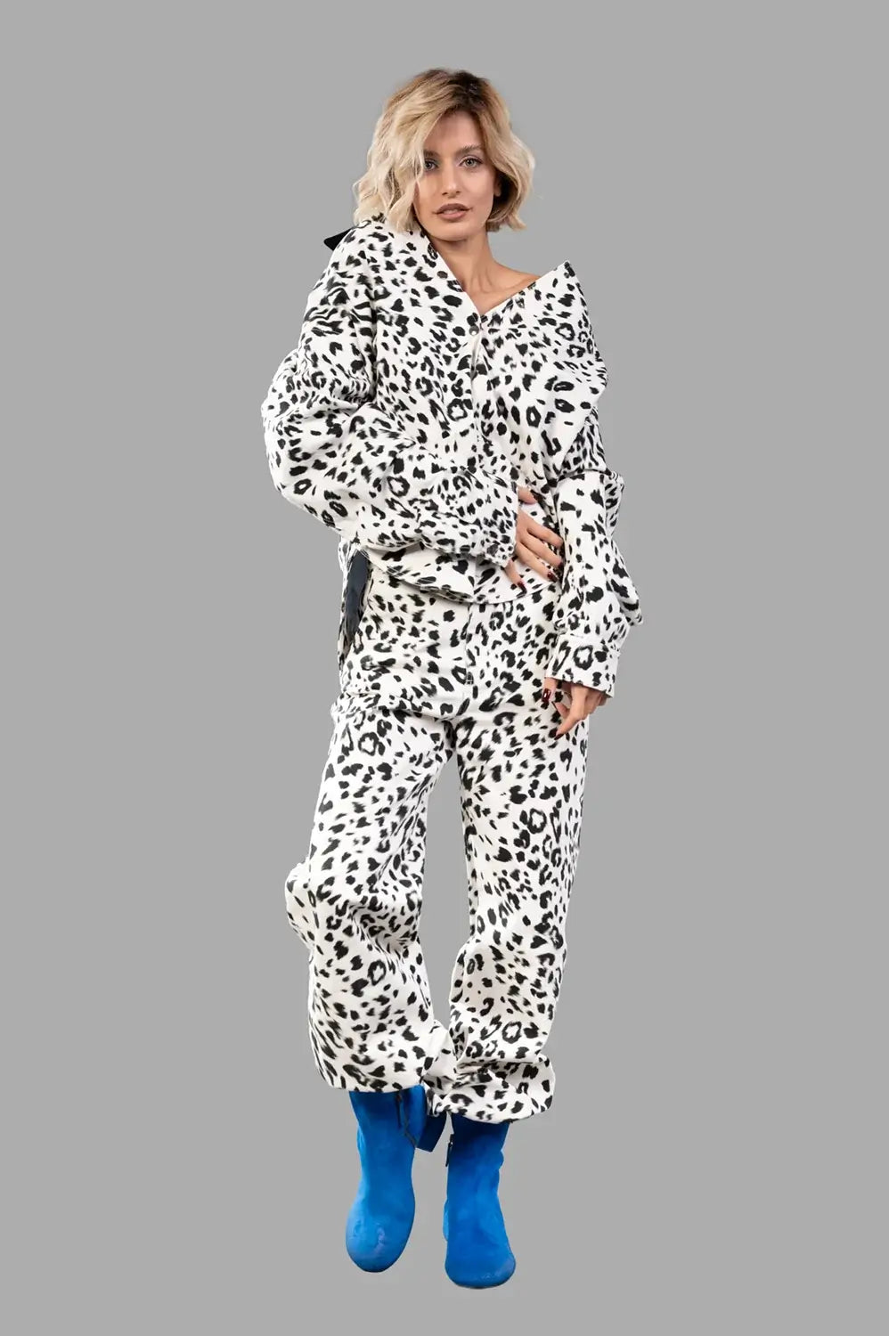 Full-length view of leopard-print workwear shirt in creme and black with contrast collar, oversized fit