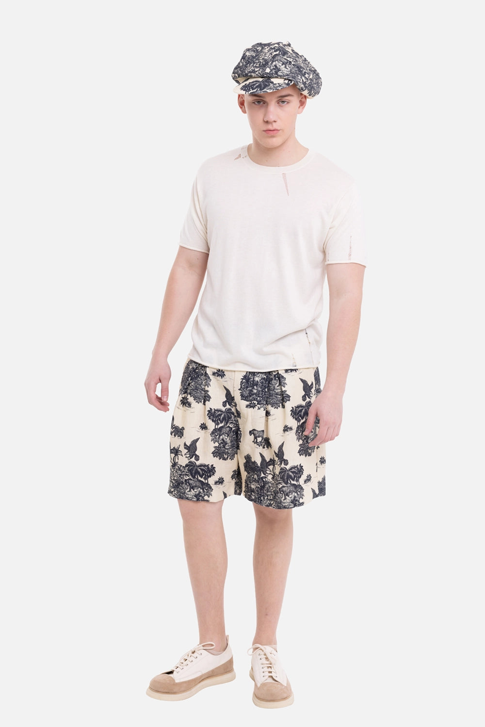 VEIN men's knit tee in cream, on-model full-length view with raw rolled edges and relaxed drape