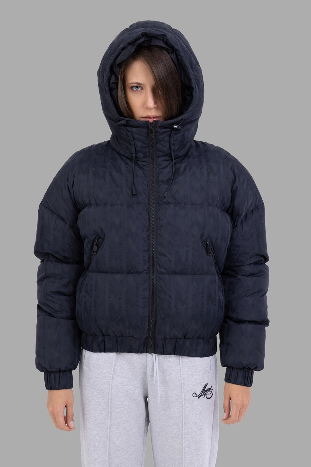 MSGM women down jacket in black, front view with hood up, two-way zip and slanted zipped pockets