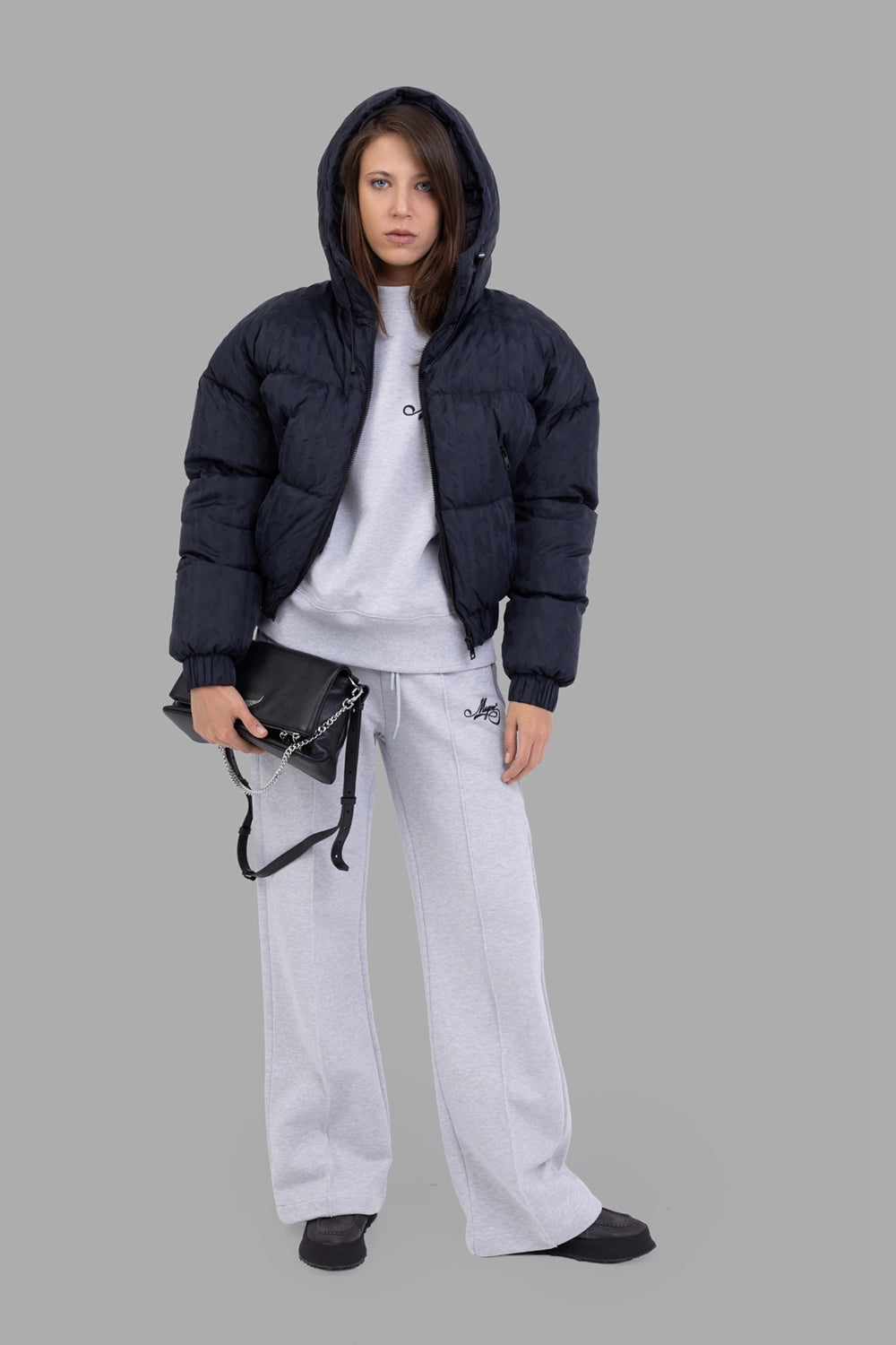 MSGM women down jacket in black, on-model full length, hooded, subtle M-jacquard and oversized fit