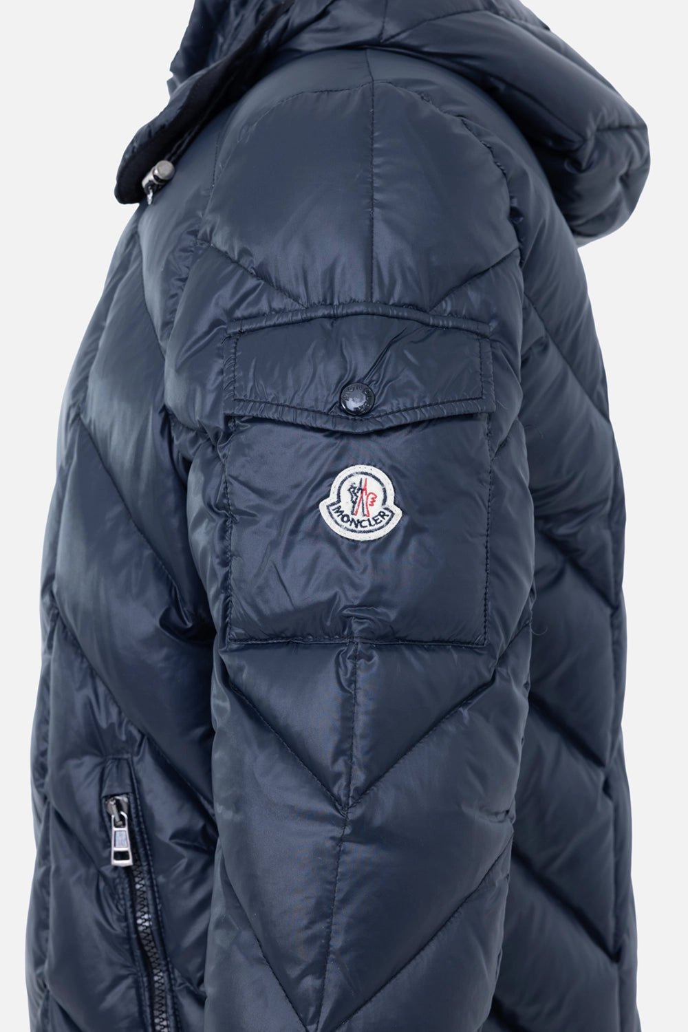 Pre-owned Moncler men's down jacket in navy, sleeve view, logo patch and buttoned flap pocket