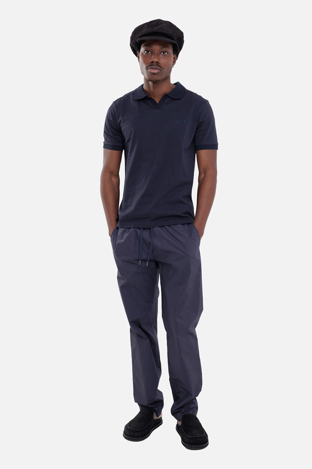 Aion men's jogger trousers in blue, on-model full-length view, elastic waist and metal-tipped drawcord