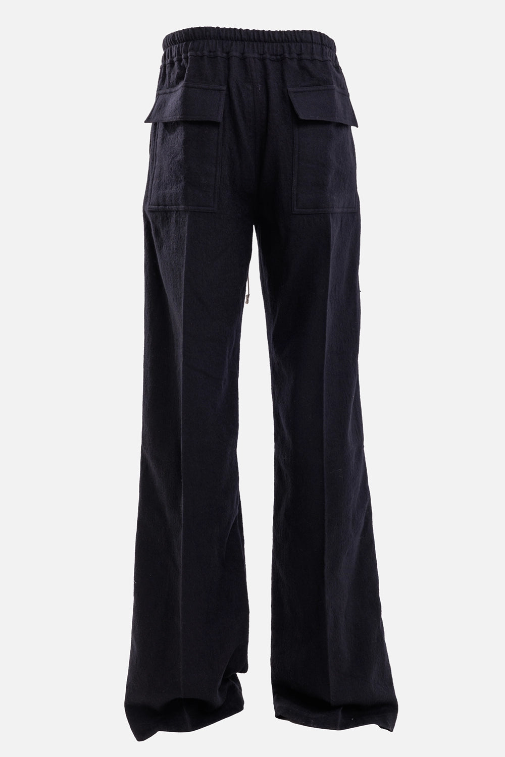 Rick Owens men's trousers in black, back view with square patch pockets and wide flap closures