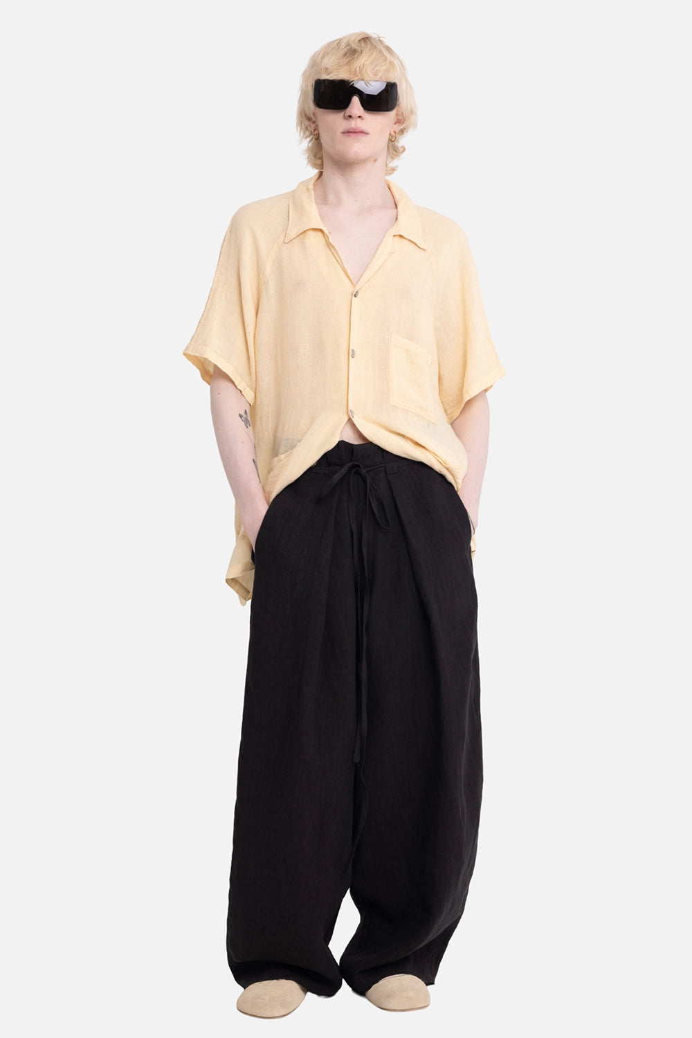 Vuscichè men's drawstring trousers in black, on-model full-length, wide pleated leg and long waist ties