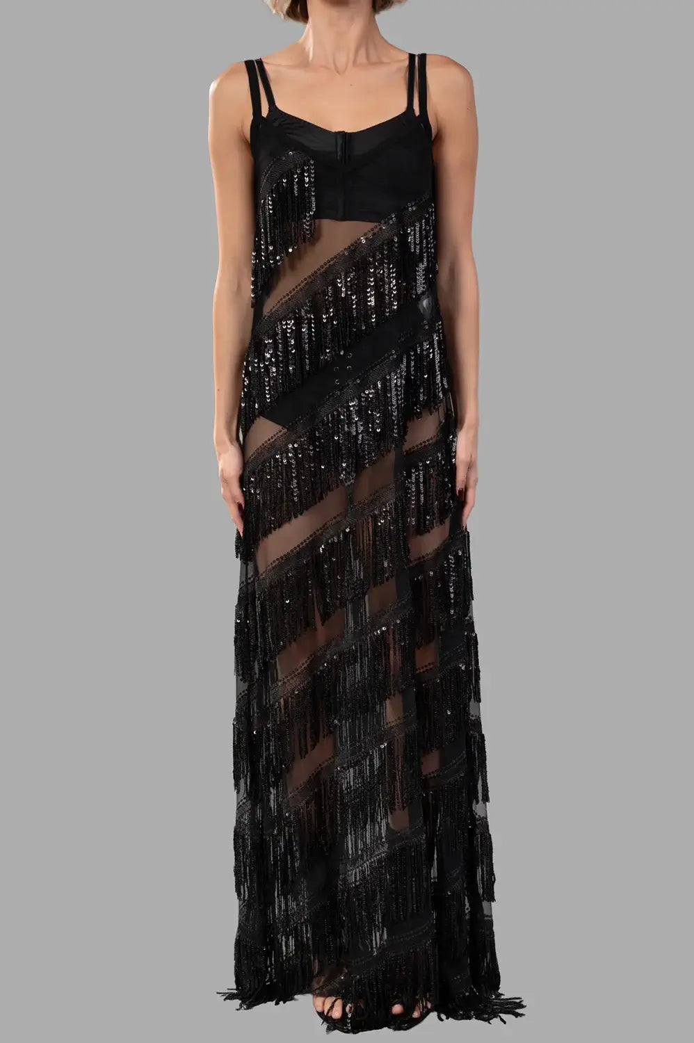 Sehnsucht Atelier fringe maxi dress in black, back view with sheer panels and tiered fringe bands