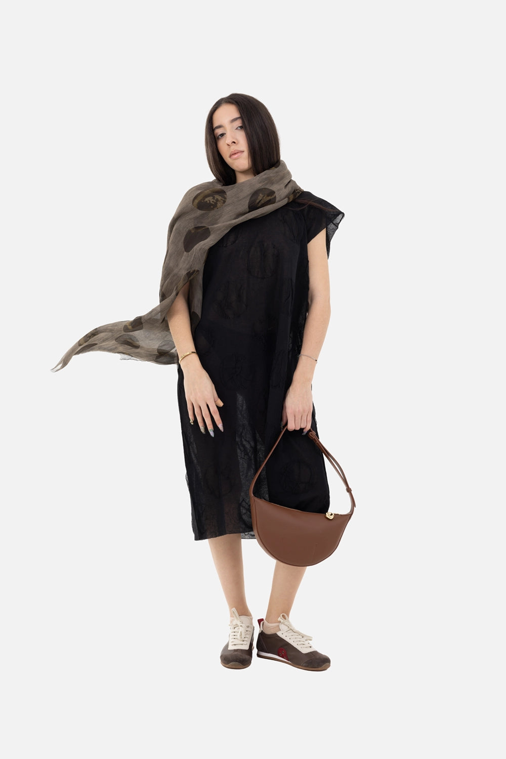 Uma Wang women’s dress in black, on-model full-length, sheer midi styled with taupe scarf and brown shoulder bag
