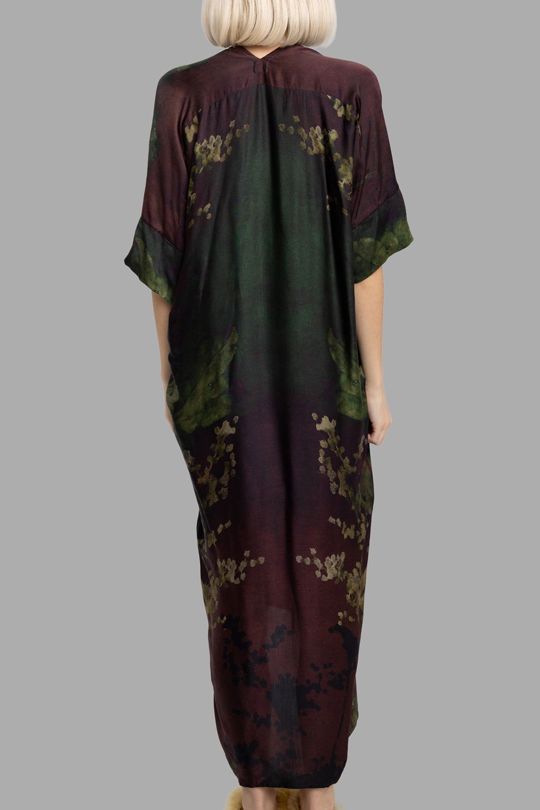 Masnada women's Nightshade print dress, back view showing fluid drape and abstract botanical pattern.