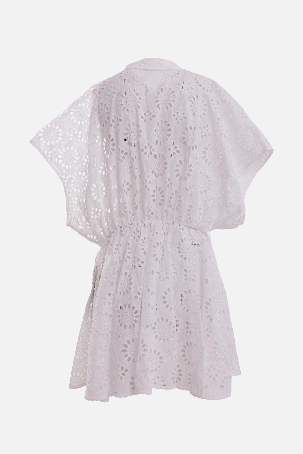 Norma Kamali women's white eyelet mini dress, back view with circular cutwork, gathered waist and flared hem