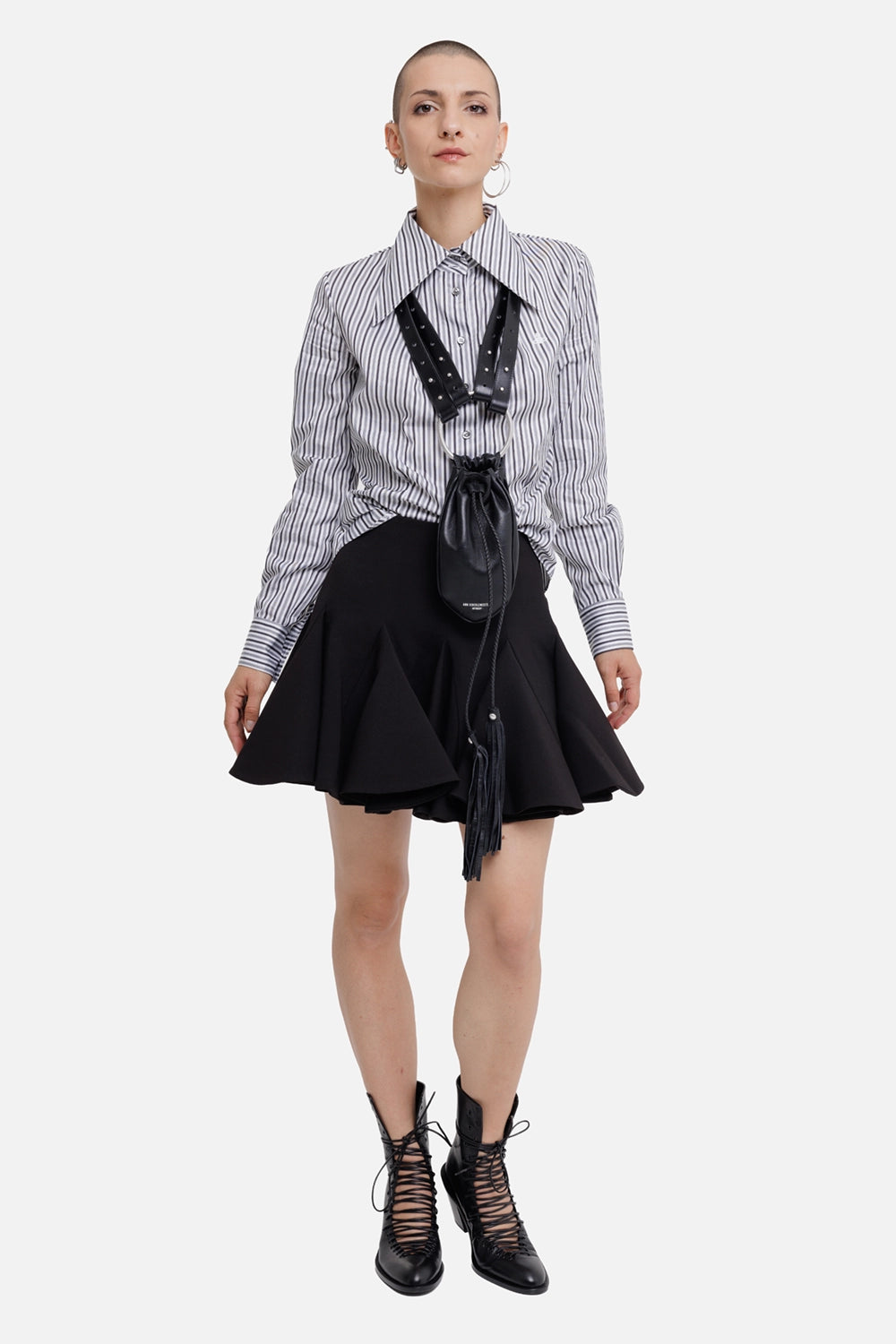 Des Phemmes women's black mini skirt, full-length model view with high waist and flared godet hem