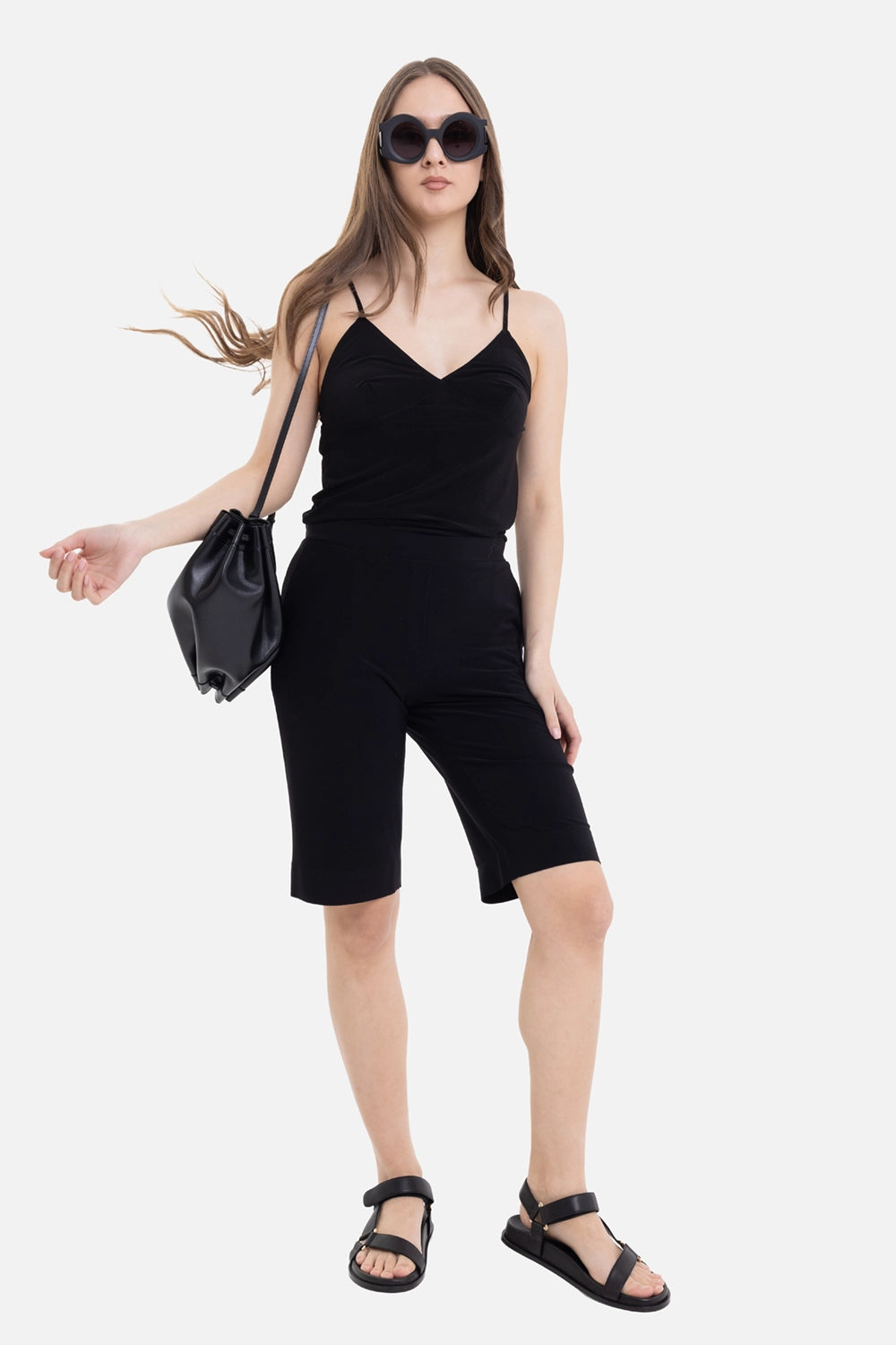 Norma Kamali women's Bermuda shorts in black, on-model full-length with pull-on waist and slim fit