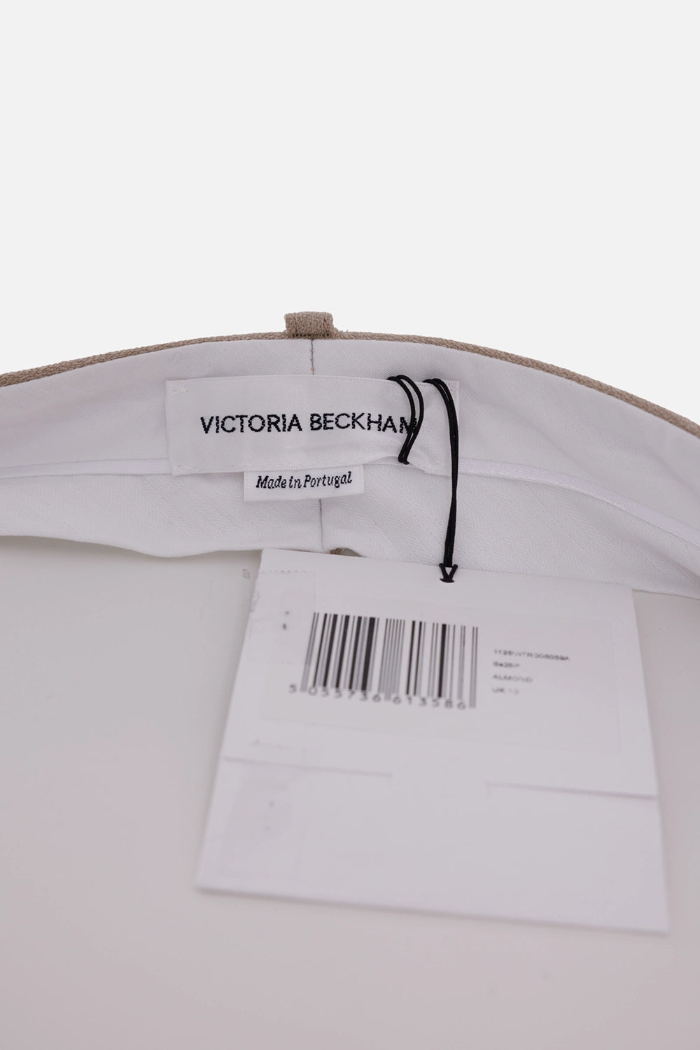 Victoria Beckham women's wool trousers in almond beige, label detail with white lining and swing tag
