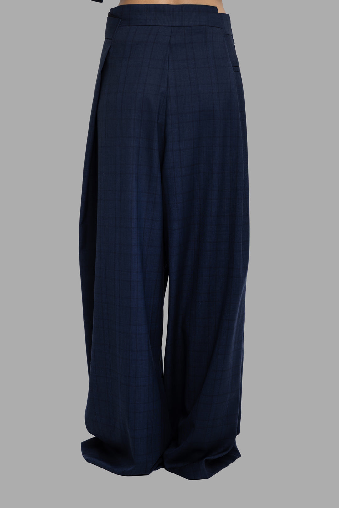 Natasha Zinko folded trousers in blue check, back view with wide leg drape and subtle check pattern