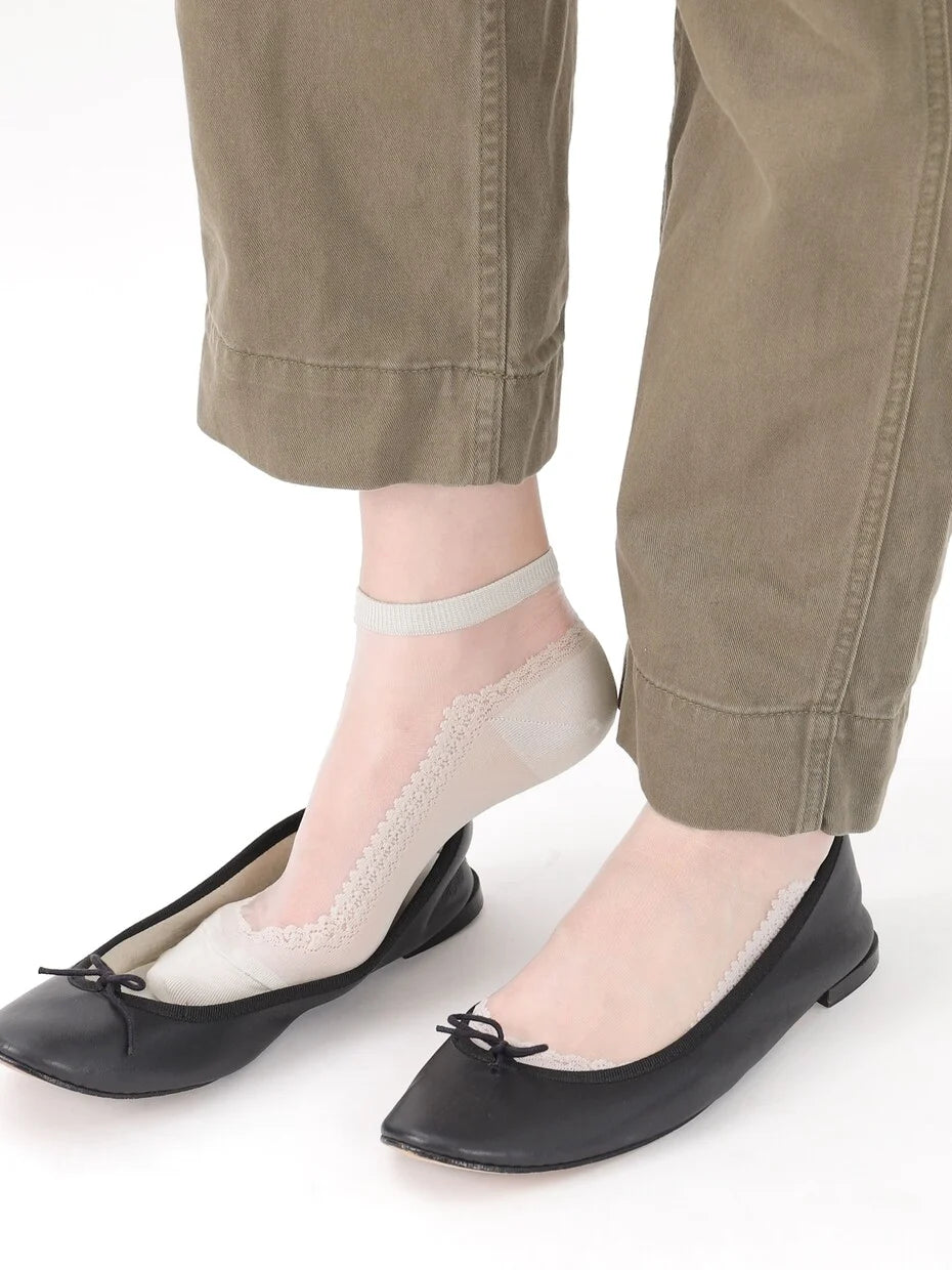 Tabio Front Tulle Ballerina Ankle Socks in beige, showing lace detail while worn with black ballet flats.