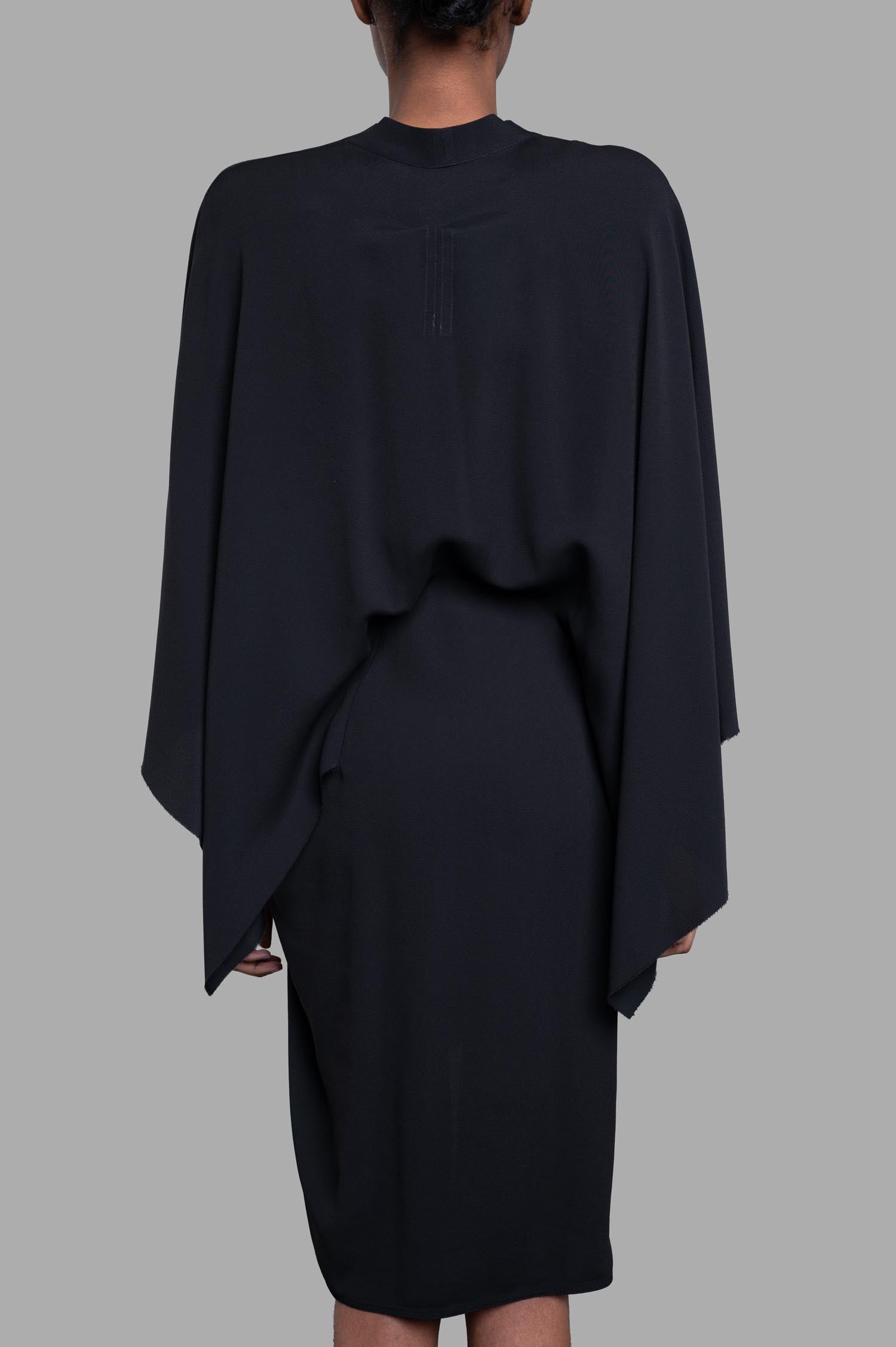 Rick Owens Half Moon Dress in black, showcasing the back with asymmetric sleeves and high-low hem detail.