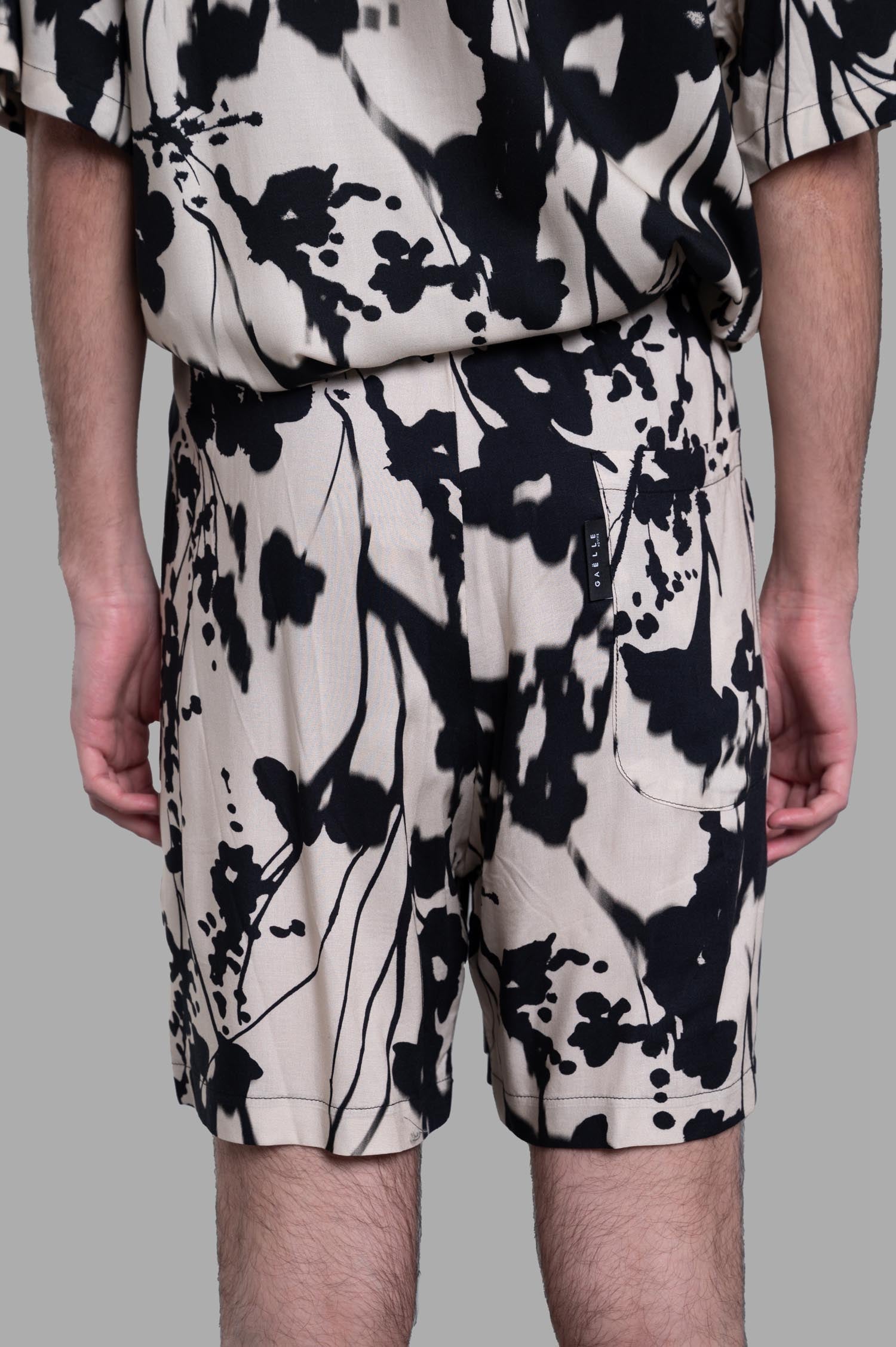 Gaëlle Paris Floral Shorts in Ecru, featuring a floral design and convenient side pockets, shown from the back.