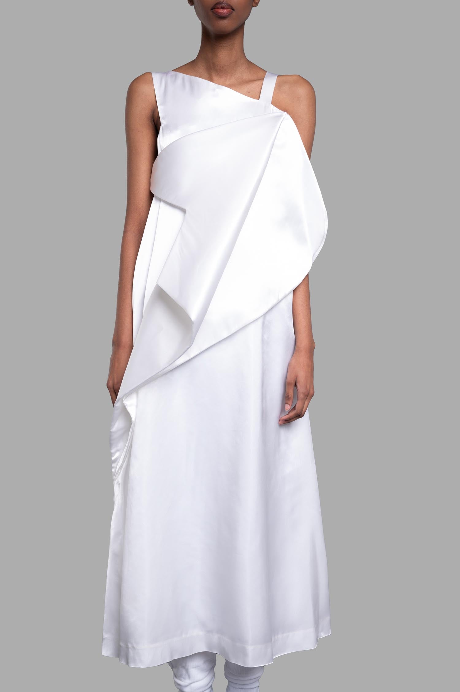 Noir Kei Ninomiya Asymmetric Dress in White, showcased on model, featuring a draped design and elegant satin finish.