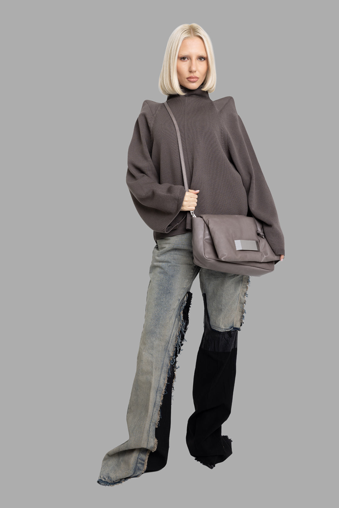 Rick Owens women's darkdust funnel-knit sweater, full-length on model with sculpted shoulders and extra-wide long sleeves