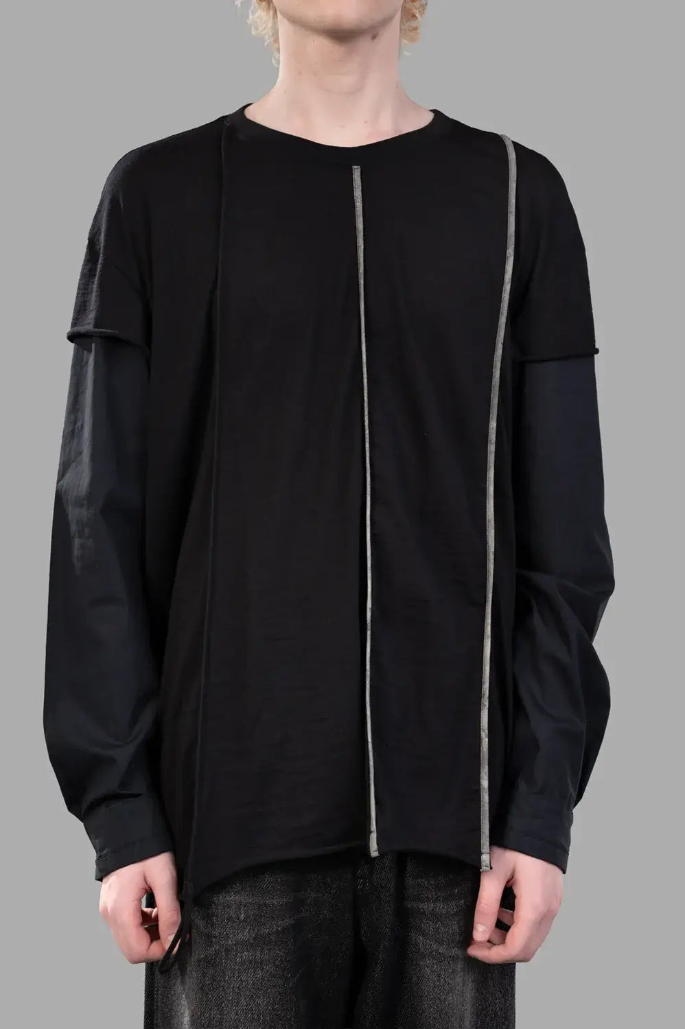 Front close-up showing crew neck, double-sleeve effect and off-center grosgrain line detail