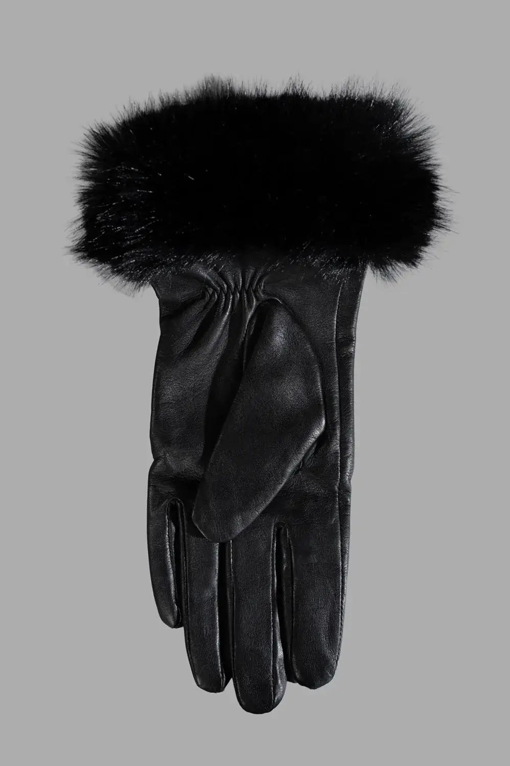 Close-up of black leather glove showing plush faux-fur cuff and smooth leather finish