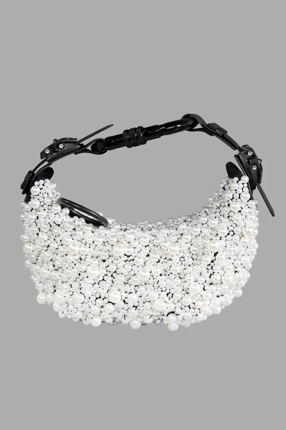 Full-length view of pearl-embellished half moon bag in white with black matte hardware and carabiner shoulder strap.