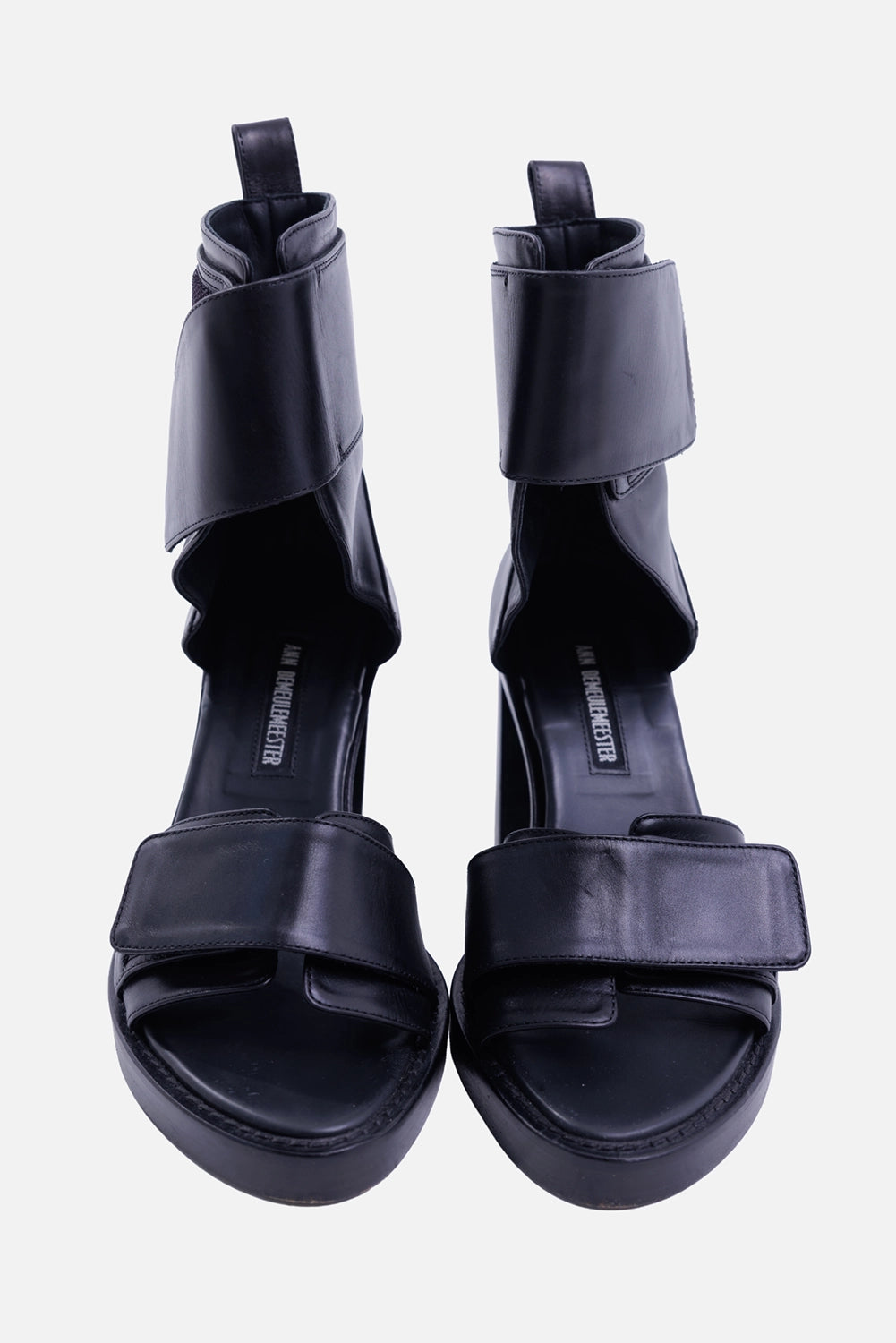 Ann Demeulemeester women's black leather sandals, front view with wide Velcro straps and open-toe platform