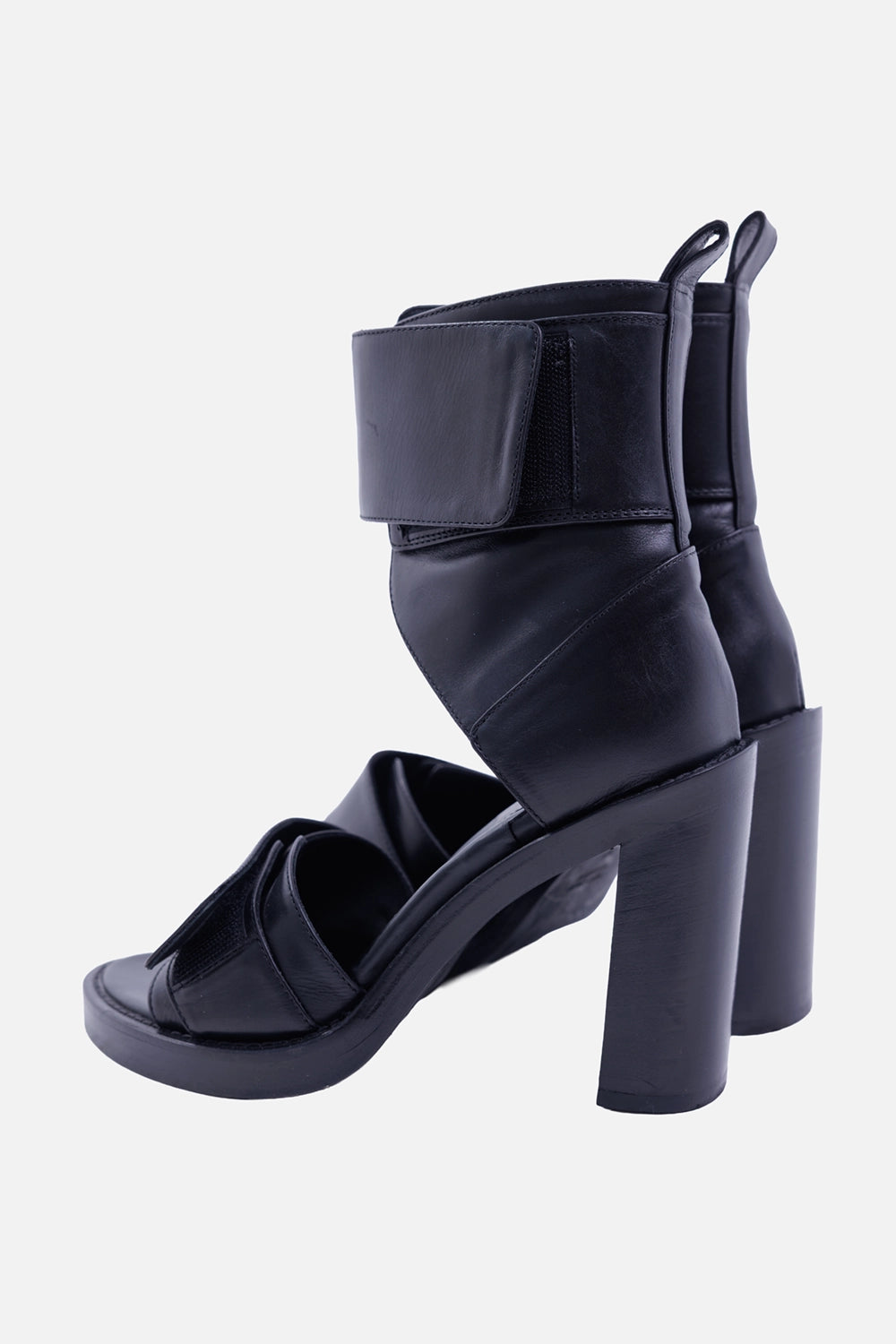 Ann Demeulemeester women's black leather sandals, side view with Velcro ankle wrap, open toe and block heel