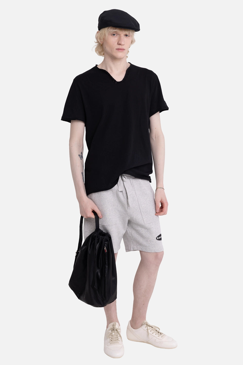 Zadig&Voltaire men's Henley T-shirt in black, on-model full-length, raw hem styled with grey shorts
