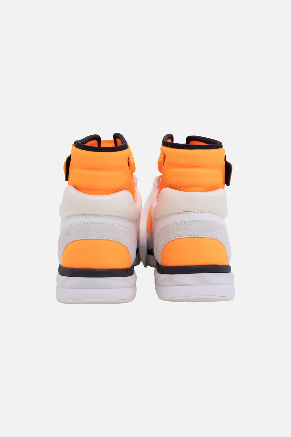 Pre-owned Chanel high-top sneakers in white and orange, back view, orange heel panels and chunky rubber sole