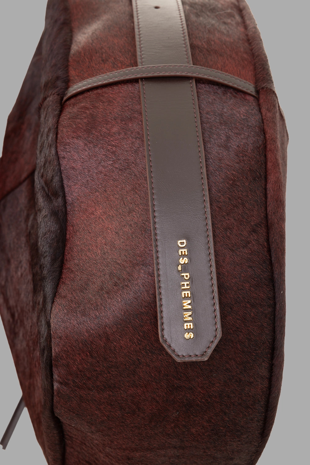 Des Phemmes women's hobo bag in Brun Brûlé, logo detail on strap end, haircalf finish and neat stitching.