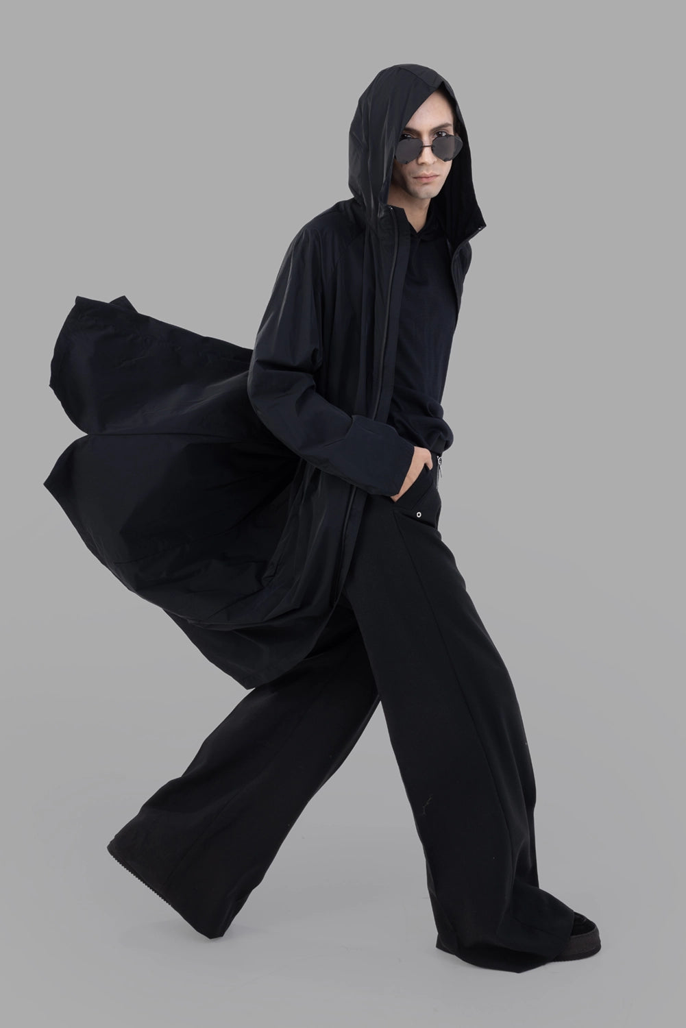 Attachment hooded coat in black, on-model full length, flowing hem and raglan sleeves