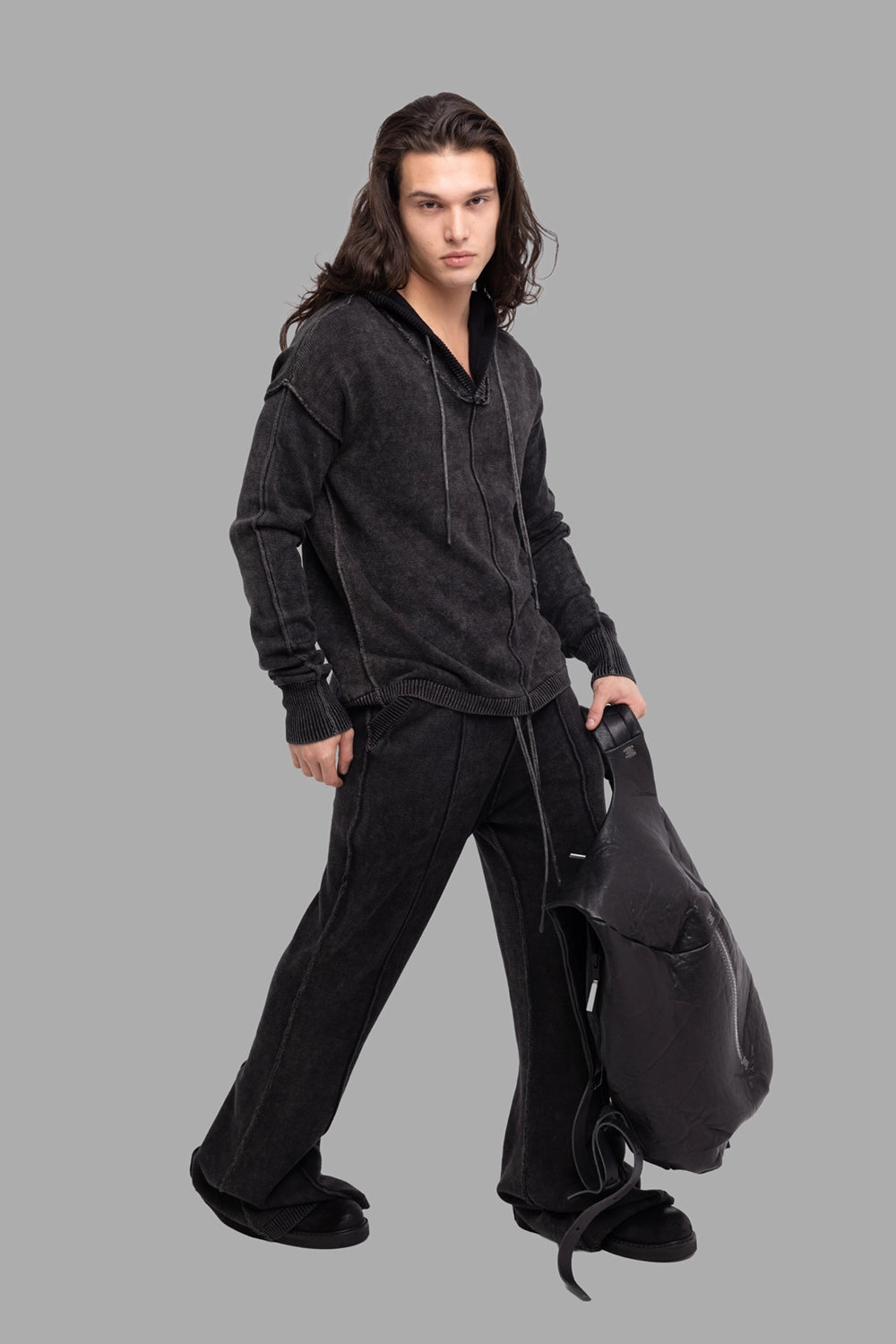 Justin Gall men’s knit hoodie in black, on-model full length, stone-wash finish and exposed center seam