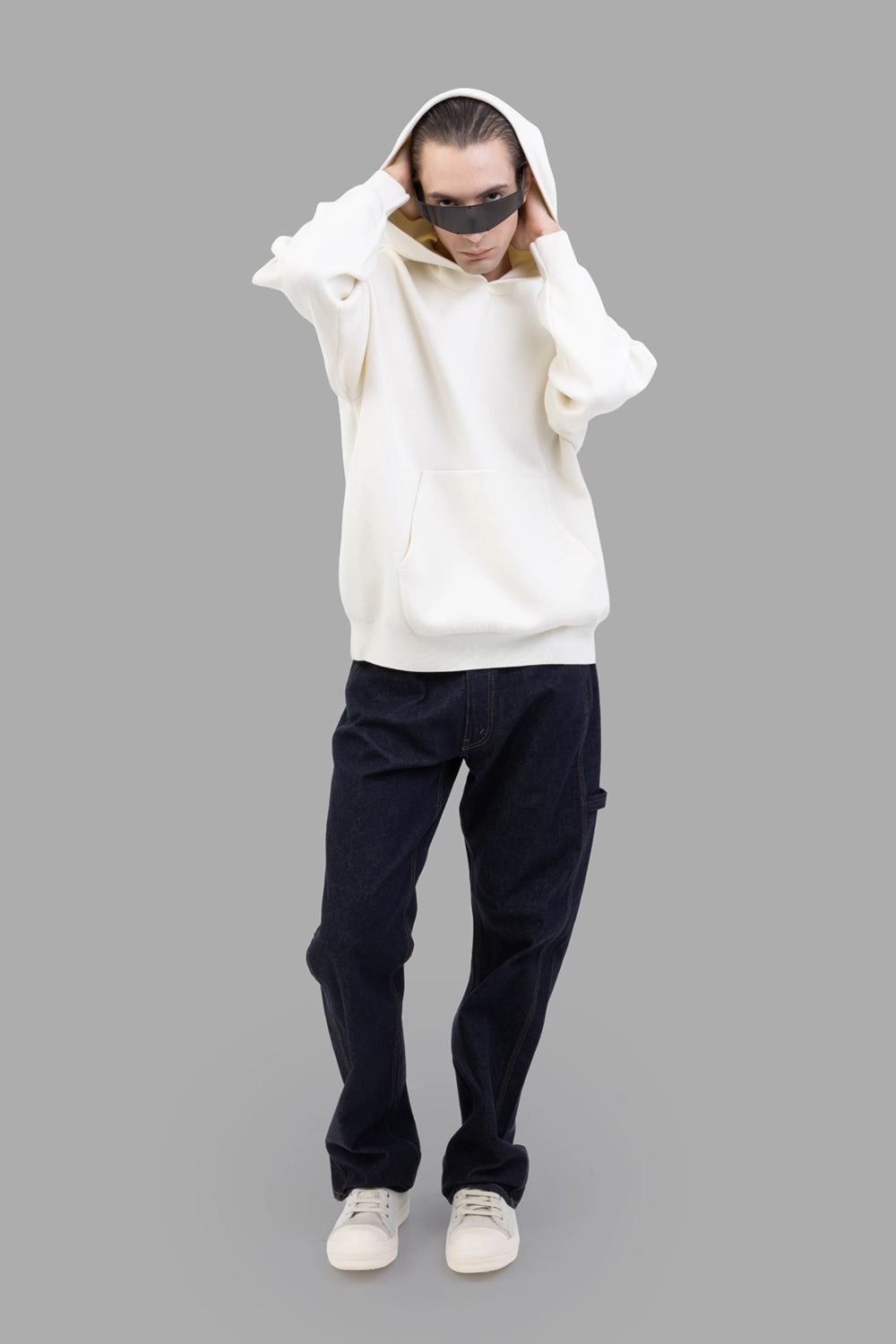 ATTACHMENT hoodie in off white, full-length on model, relaxed fit with roomy hood