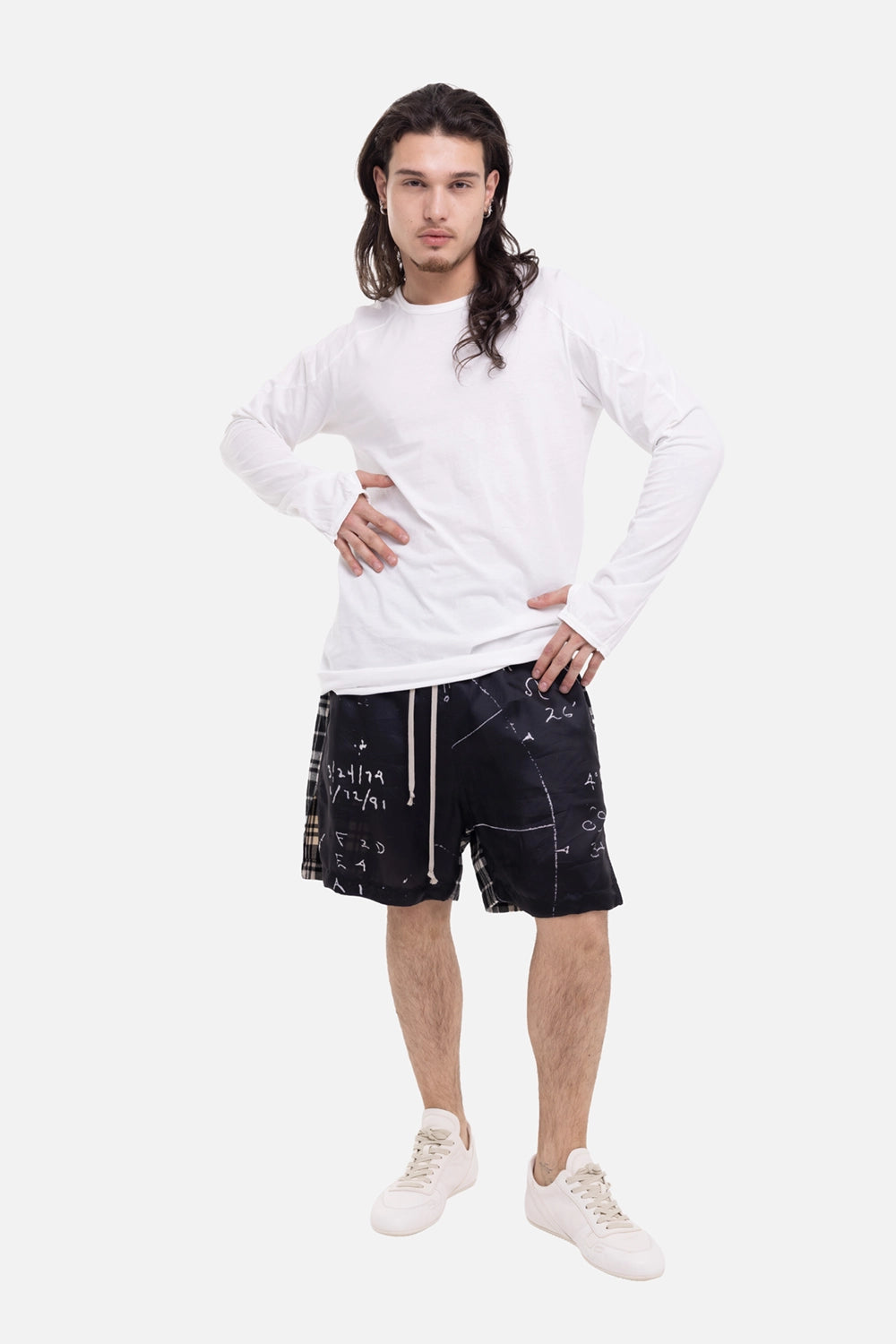 69 by Isaac Sellam men's long-sleeve T-shirt in white, on-model full-length view with thumb openings