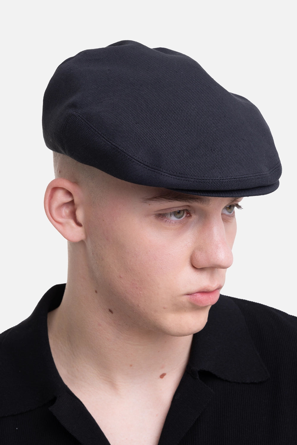 KIJIMA TAKAYUKI hunting cap in black, side view, streamlined low-profile shape
