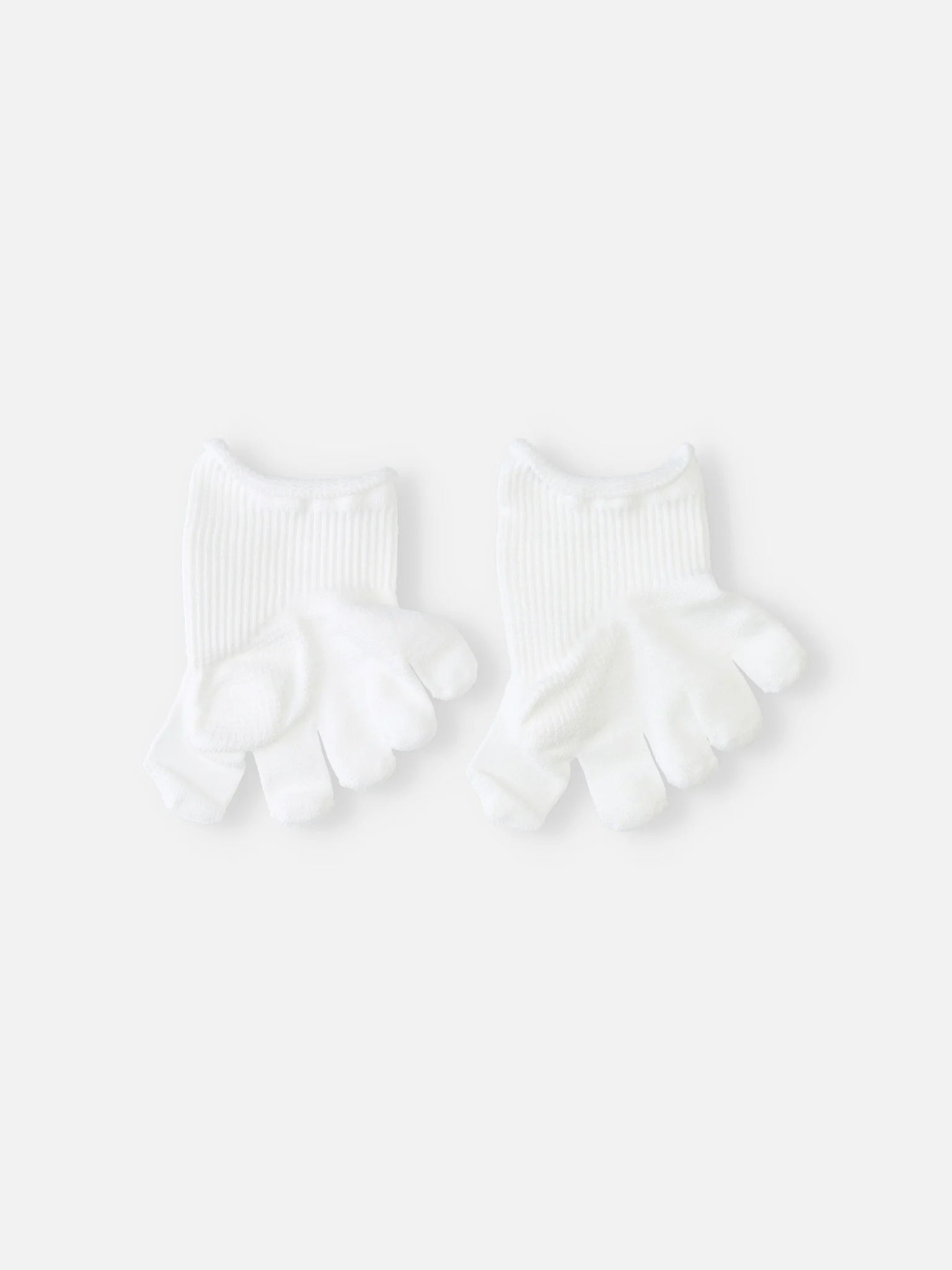 Tabio. Toe Cover For Hallux Valgus in white, showing half-socks with separated toes for pressure relief and support.