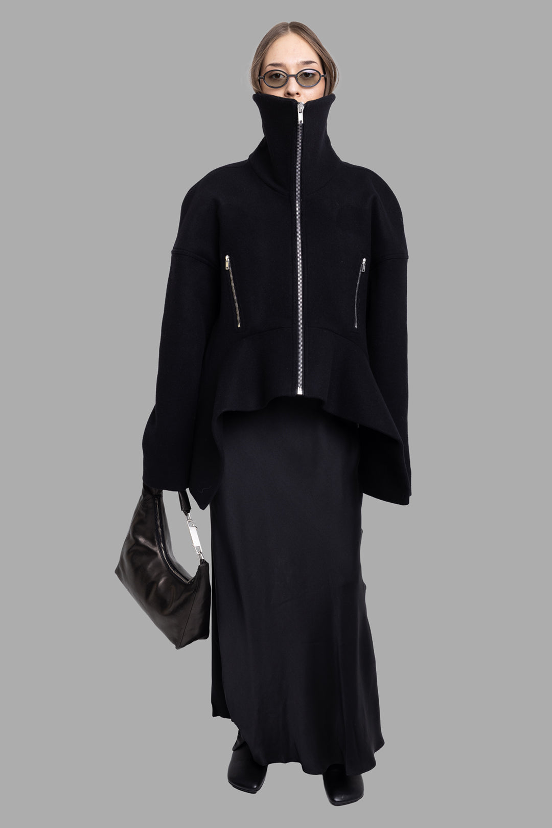 Rick Owens women's black wool Draculimo jacket, on-model full length, high funnel collar and flared asymmetric hem
