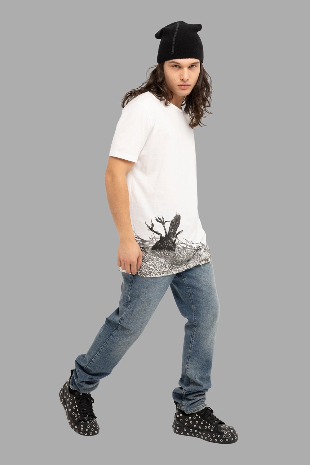 Gaelle Paris men’s jeans in blue, on-model full length, mid-wash with natural whiskers