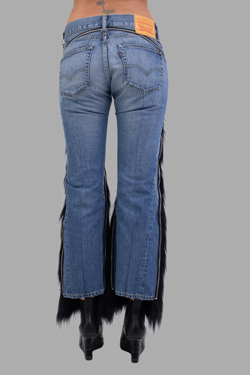 Junya Watanabe x Levi’s women’s jeans in indigo/black, back view, rear zip track and Levi’s leather patch