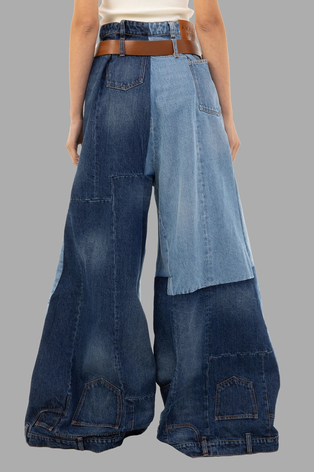 A.W.A.K.E. MODE women's jeans in Mid Blue, back view, multi-tone patchwork with reworked hem panels