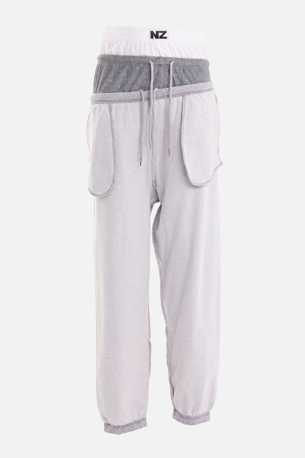 Natasha Zinko women's jogger pants in grey, back view, contrast overlock seams and elastic cuffs