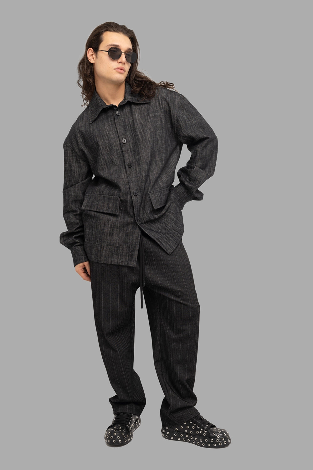 Gaelle Paris men’s jogger trousers in black pinstripe, on-model full length, elastic waist with drawcord
