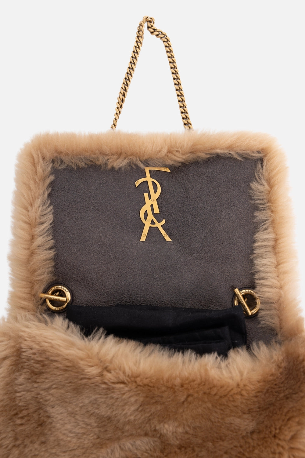 Pre-owned Saint Laurent women’s shoulder bag in camel, logo detail view, gold Cassandre hardware on shearling
