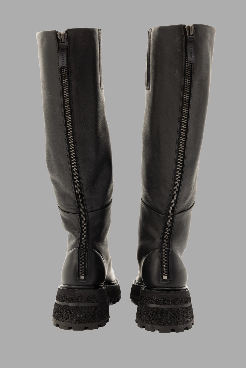 Marsèll women’s knee-high boots in black, rear view, full-length zipper and lugged outsole